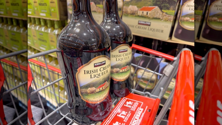 Two bottles of Kirkland Signature Irish Cream Liqueur in a cart at Costco