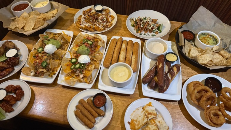 all Applebee's appetizers on brown wooden table