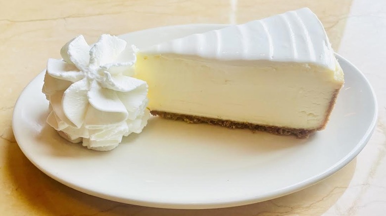 A slice of The Cheesecake Factory's Original Cheesecake is shown.