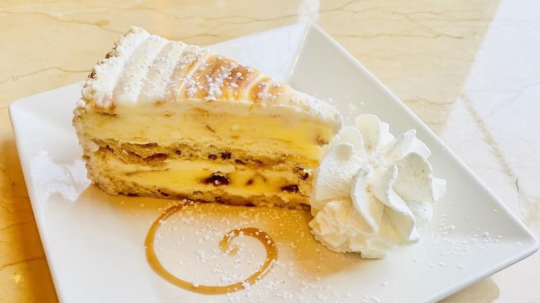 A slice of The Cheesecake Factory's Cinnabon Cinnamon Swirl Cheesecake is shown.
