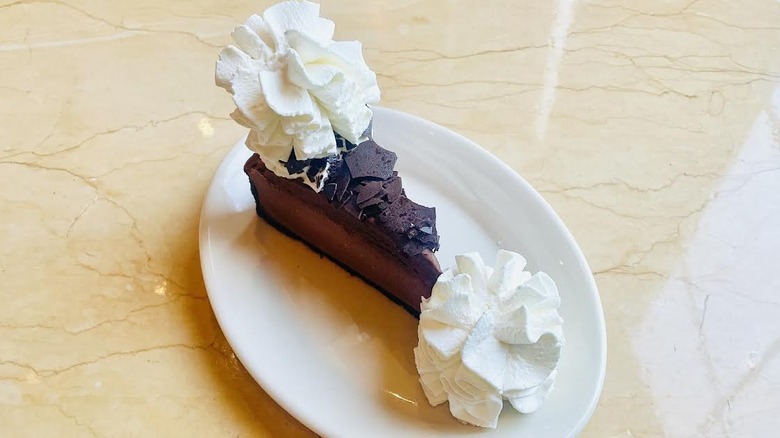 A slice of The Cheesecake Factory's Chocolate Mousse Cheesecake is shown.