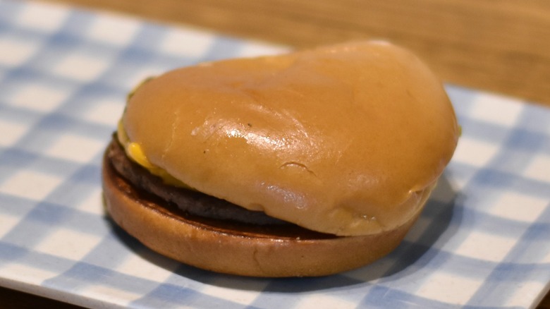 McDonald's cheeseburger on plate