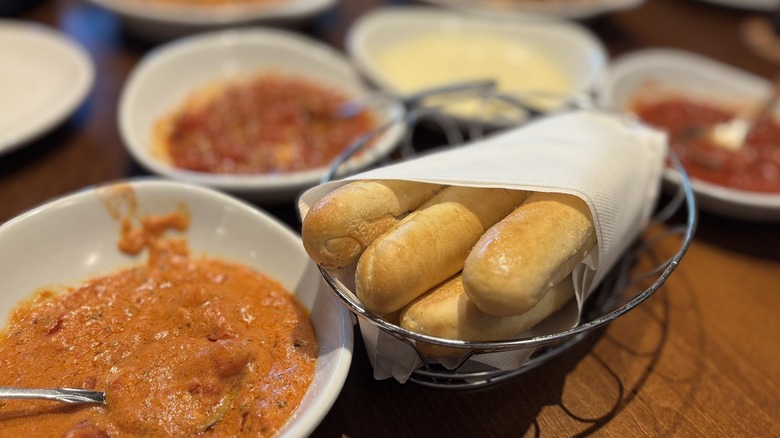 Olive Garden Dipping Sauces with Breadsticks on table