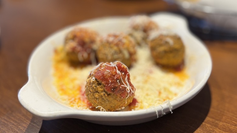 Olive Garden Meatballs Parmigiana in dish on table
