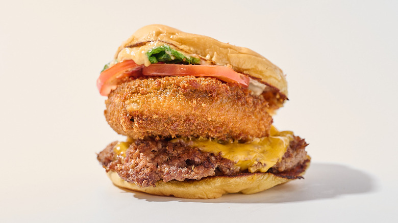 Burger with fried mushroom on a table