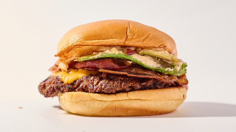 avocado bacon burger on a table