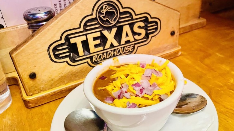 A cup of Texas Roadhouse Texas Red Chili appetizer is shown.