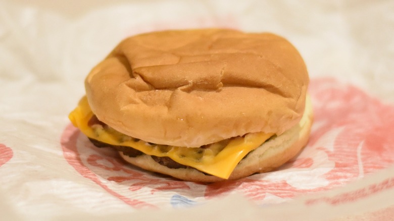 A burger with cheese on a bun