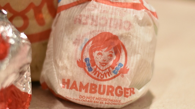 A Wendy's hamburger wrapped in paper