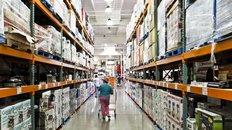 Costco customer walking down an aisle