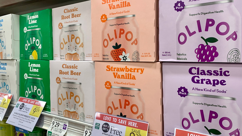 Cases of prebiotic soda in supermarket