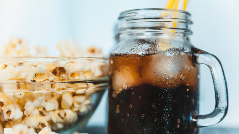 Mug of soda and popcorn