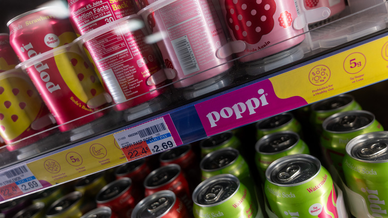 Cans of prebiotic soda in store