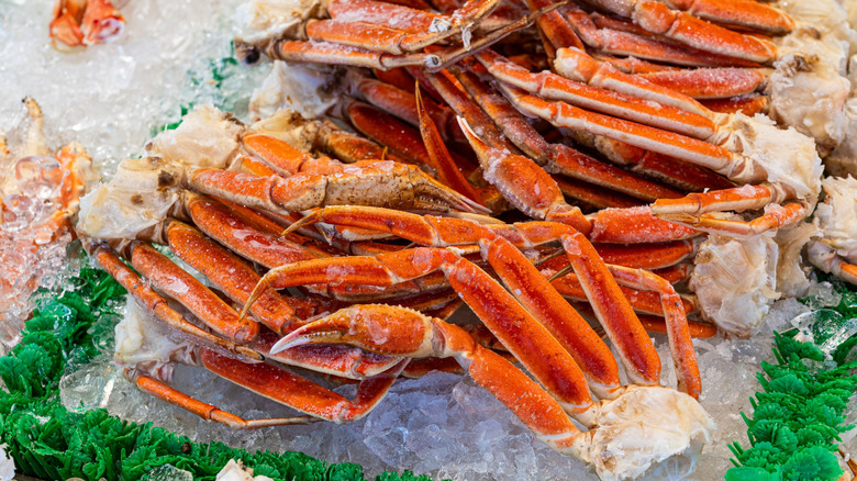 Frozen crab legs on ice