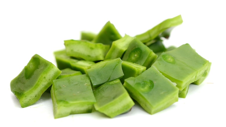 Chopped nopales against a white background