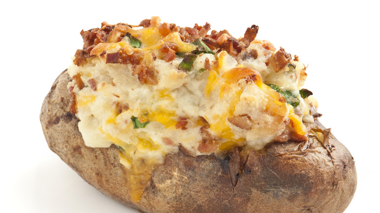 baked potato with red crumbles