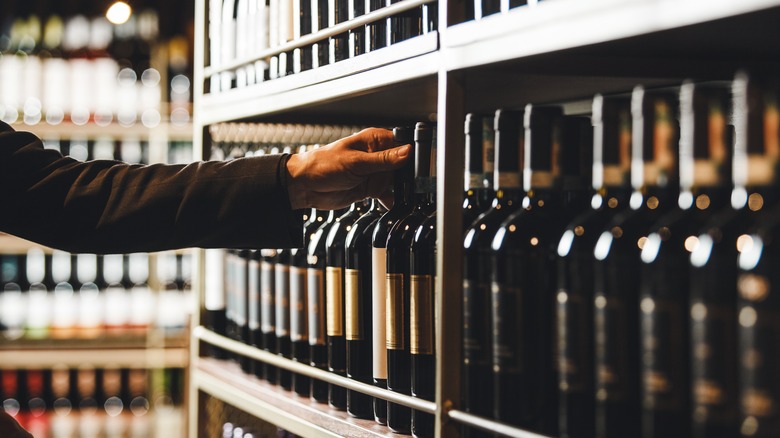 Grabbing wine off store shelf