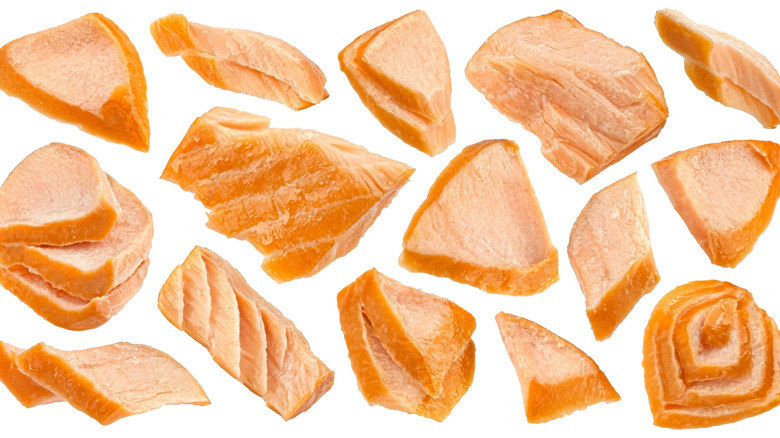 pieces of smoked salmon on white background