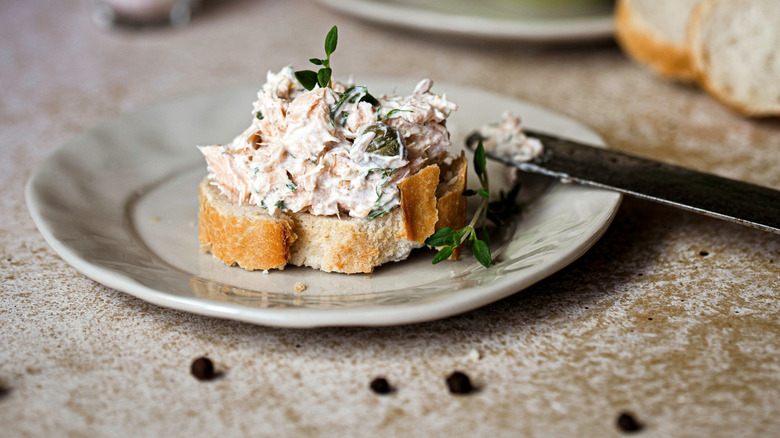 salmon pâté on toast with herbs and capers