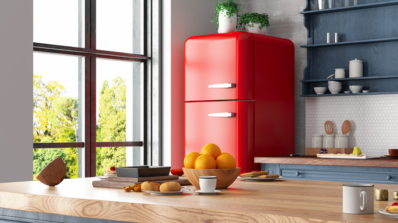 Red refrigerator in kitchen
