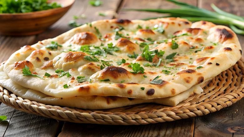 Naans on a woven tray