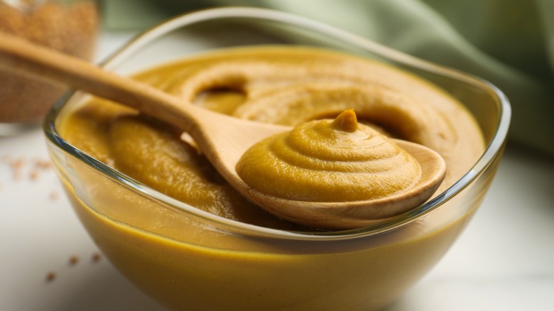 mustard in bowl with spoon