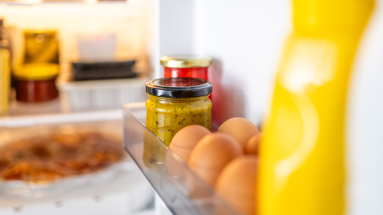 jar of mustard in fridge