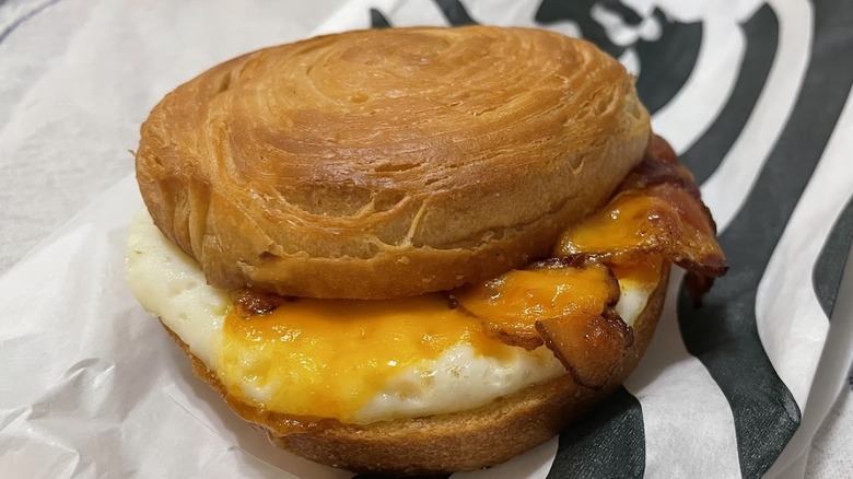 A bacon, cheddar, and egg sandwich from Starbucks