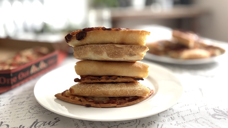 stack of pizza crusts on a plate