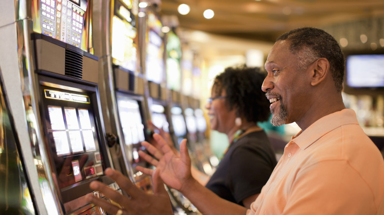 Man and woman gambling in casino