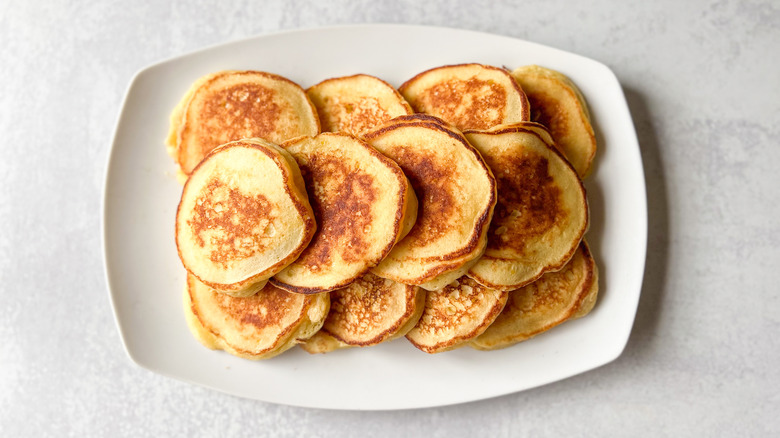 Fluffy lemon ricotta pancakes on serving platter
