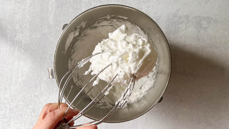 Egg whites beaten to stiff peaks in mixer bowl