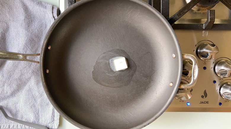 Melting butter in skillet on stove