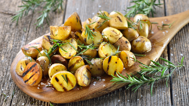 Grilled baby potatoes on table