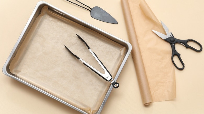 Parchment paper, sheet pan, and scissors