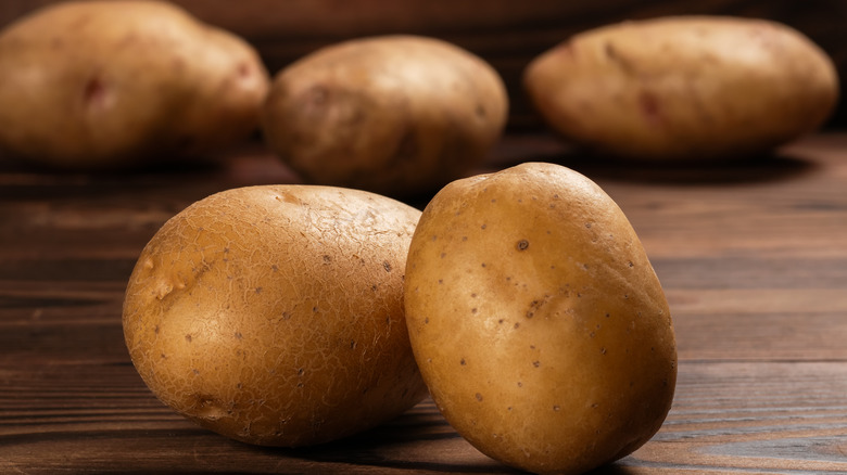 potatoes on wood surface