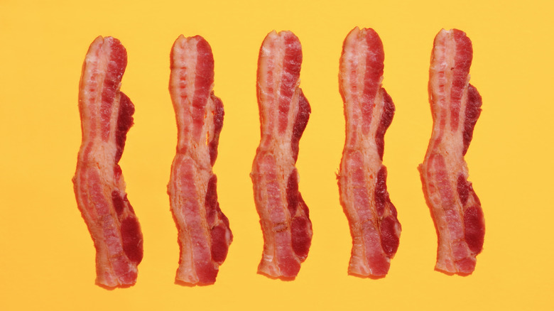 bacon strips on yellow background