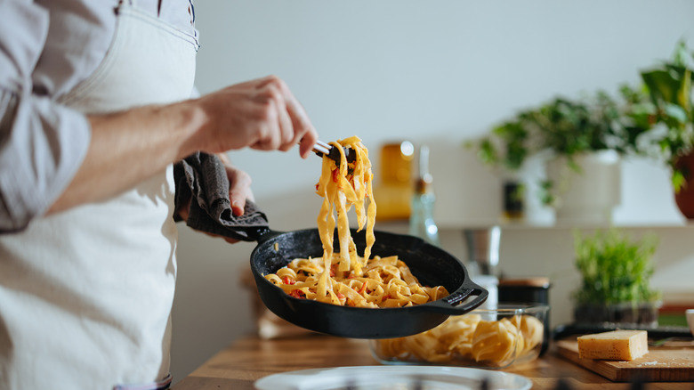 Chef serving pasta