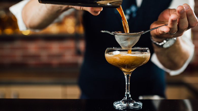 Bartender making spiked coffee