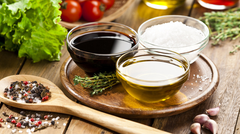 Vinegar, oil, and salt on a serving dish