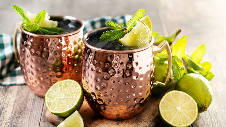 Moscow mule in copper mug with lime wedges