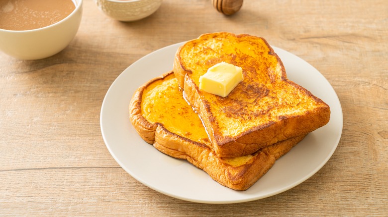 buttered French toast sitting on a table