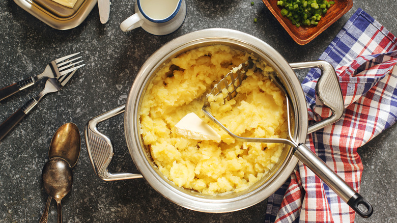 Potatoes with potato masher