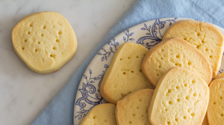 Plate of shortbread cookies over blue towel