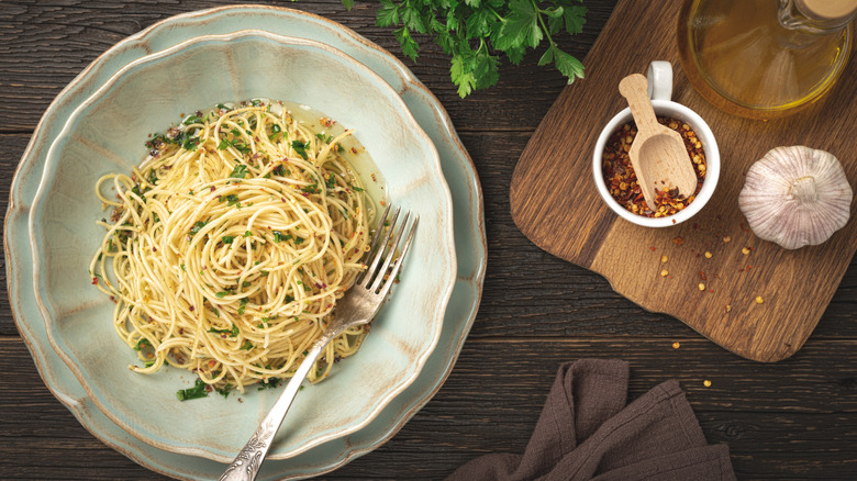 aglio e olio with garlic head, olive oil, chili flakes