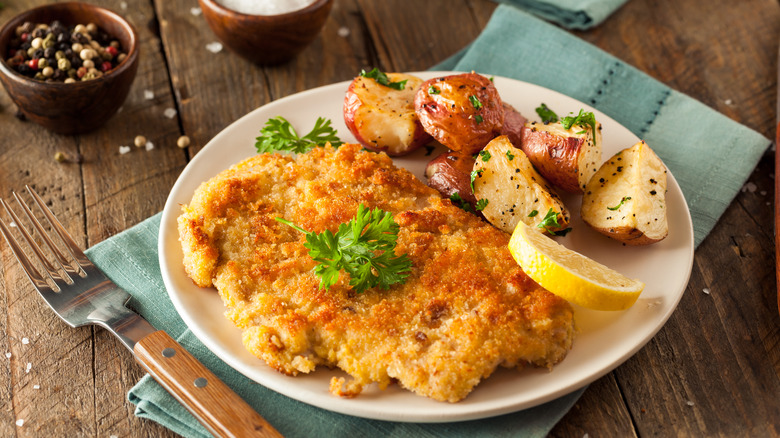 Weinerschnitzel with potatoes on a plate