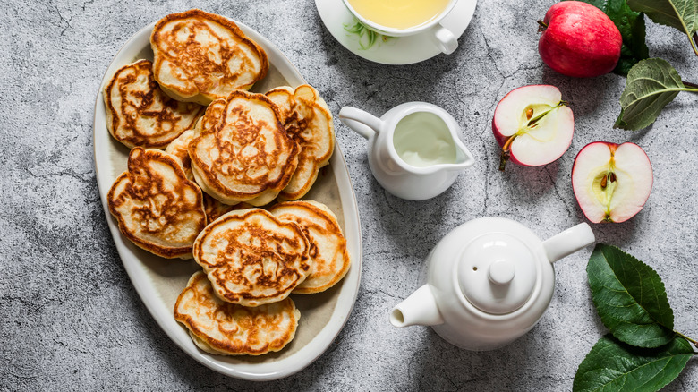 Apple pancakes on table
