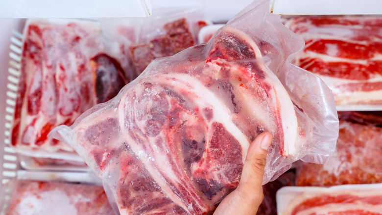 Frozen meat wrapped in plastic