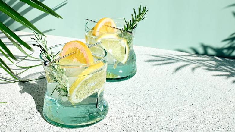 Blue drink with lemon and rosemary