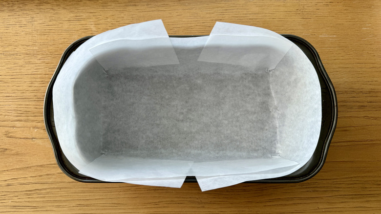 loaf pan lined with white paper